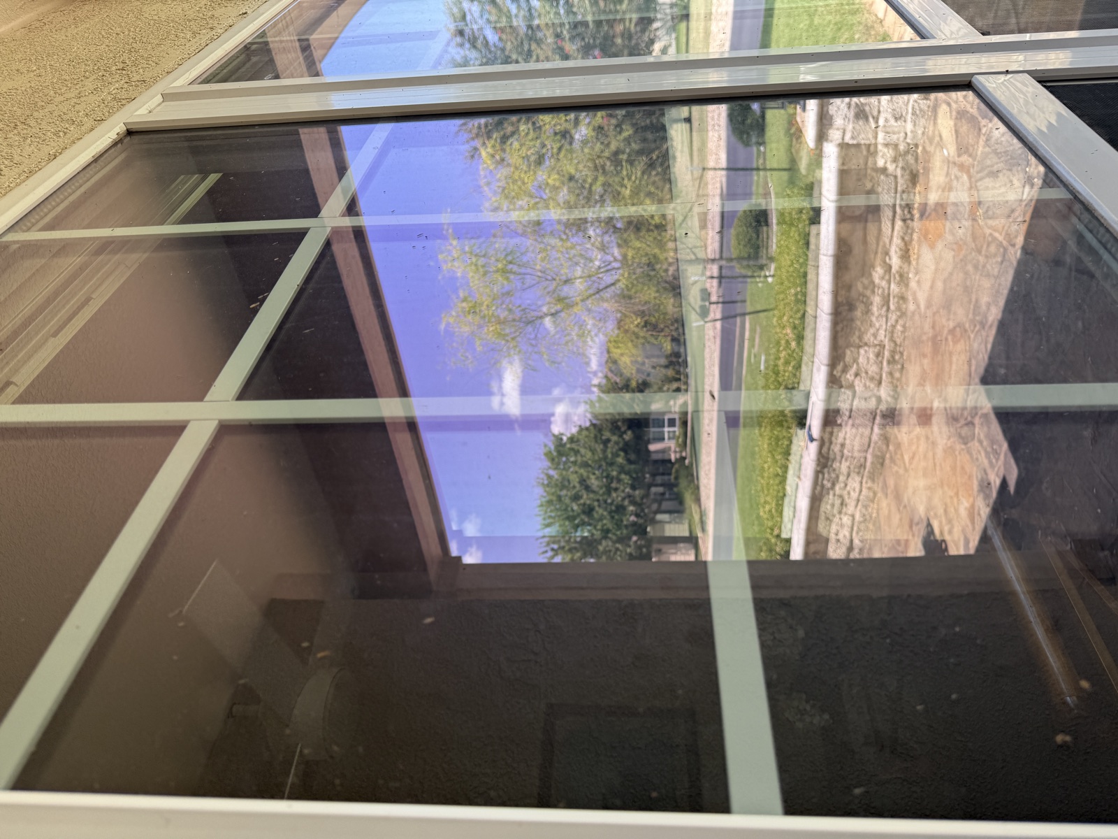 Close view of spotted residential window glass before cleaning